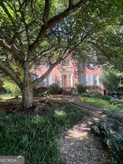 974 Bloomfield Dr, Lawrenceville, GA 30044 - view of property hidden behind natural elements featuring brick siding