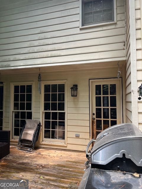 974 Bloomfield Dr, Lawrenceville, GA 30044 - wooden porch featuring a grill