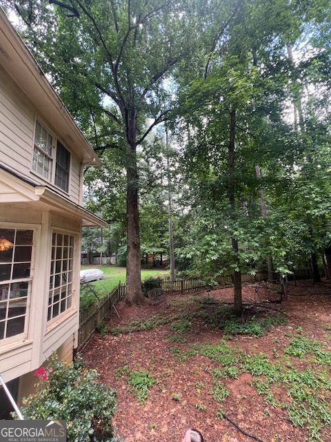 974 Bloomfield Dr, Lawrenceville, GA 30044 - view of yard featuring view of wooded area