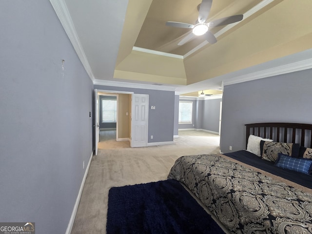 176 Fairoaks Cir, Stockbridge, GA 30281 - bedroom with light carpet, ornamental molding, a tray ceiling, and a ceiling fan