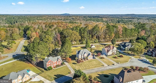 176 Fairoaks Cir, Stockbridge, GA 30281 - aerial view of property and surrounding area featuring a forest and nearby suburban area
