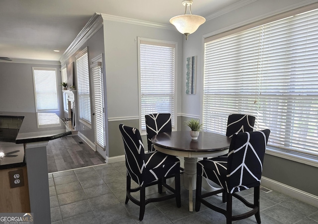 176 Fairoaks Cir, Stockbridge, GA 30281 - dining area featuring healthy amount of natural light, tile patterned flooring, and crown molding