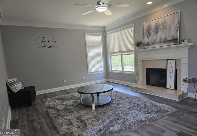 176 Fairoaks Cir, Stockbridge, GA 30281 - sitting room featuring a premium fireplace, ceiling fan, wood finished floors, crown molding, and recessed lighting