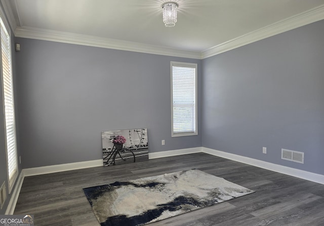 176 Fairoaks Cir, Stockbridge, GA 30281 - unfurnished room with healthy amount of natural light, crown molding, dark wood-style flooring, and a chandelier