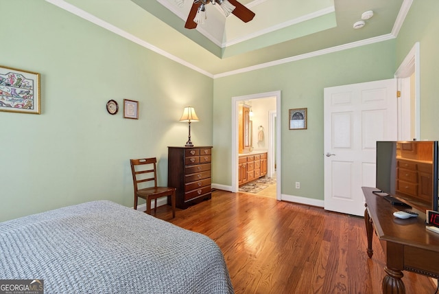 865 Laurel Ridge Rd, Cleveland, GA 30528 - bedroom with wood finished floors, a tray ceiling, ornamental molding, ensuite bath, and a ceiling fan