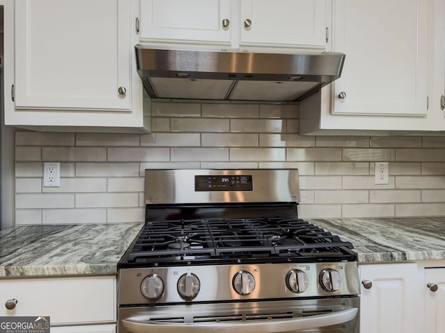 1904 Watercrest Cir, Lawrenceville, GA 30043 - kitchen with gas range, range hood, white cabinets, and light stone counters
