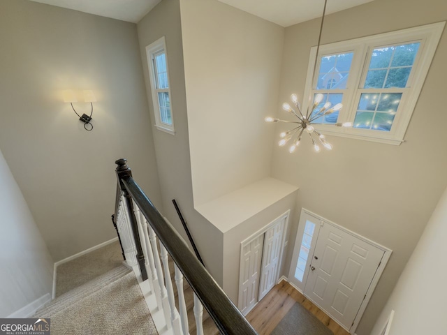 1904 Watercrest Cir, Lawrenceville, GA 30043 - stairs featuring plenty of natural light and a chandelier
