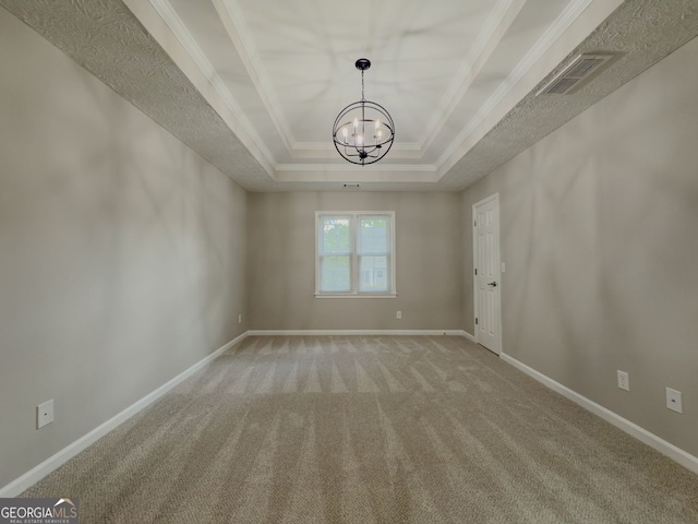 1904 Watercrest Cir, Lawrenceville, GA 30043 - carpeted spare room featuring a raised ceiling, a chandelier, and ornamental molding