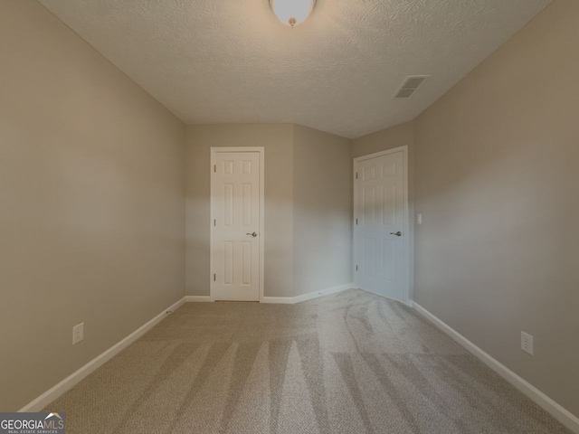 1904 Watercrest Cir, Lawrenceville, GA 30043 - spare room featuring a textured ceiling and carpet flooring