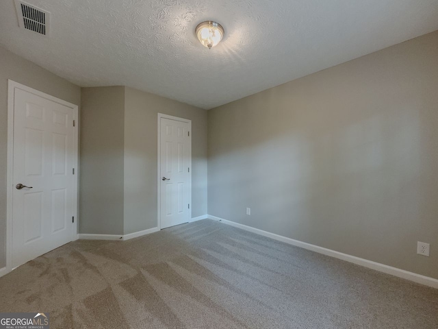 1904 Watercrest Cir, Lawrenceville, GA 30043 - carpeted empty room with baseboards and a textured ceiling