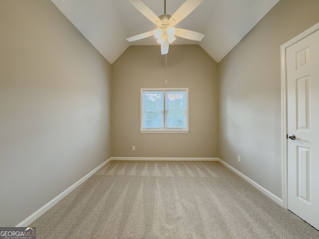 1904 Watercrest Cir, Lawrenceville, GA 30043 - spare room with ceiling fan, light carpet, and vaulted ceiling