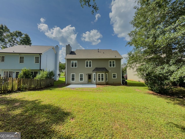 1904 Watercrest Cir, Lawrenceville, GA 30043 - back of house featuring a chimney and a patio area