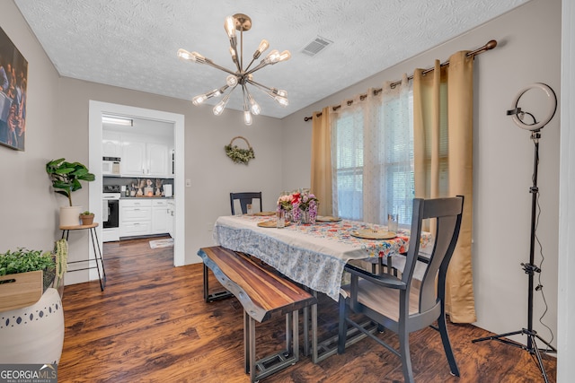 116 Rickman St, Toccoa, GA 30577 - dining area featuring a chandelier, dark wood finished floors, and a textured ceiling