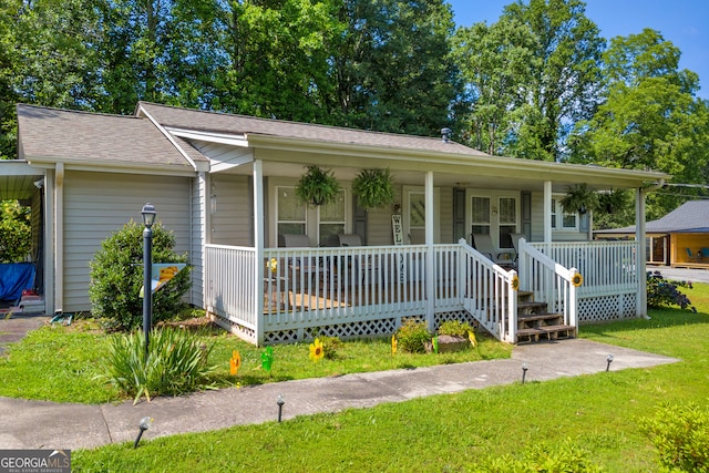 116 Rickman St, Toccoa, GA 30577 - view of front of property featuring covered porch, a front yard, and a shingled roof