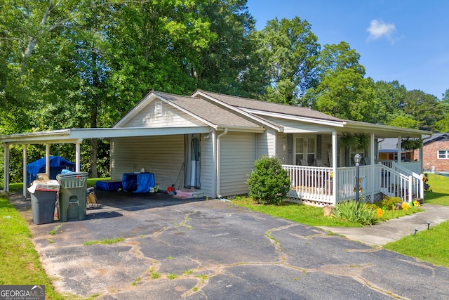 116 Rickman St, Toccoa, GA 30577 - view of front of property featuring driveway, a porch, a carport, and a shingled roof