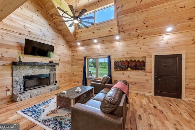 2092 Pleasant Hill Rd NE, Ranger, GA 30734 - living room with ceiling fan, wood finished floors, a stone fireplace, wooden walls, and high vaulted ceiling
