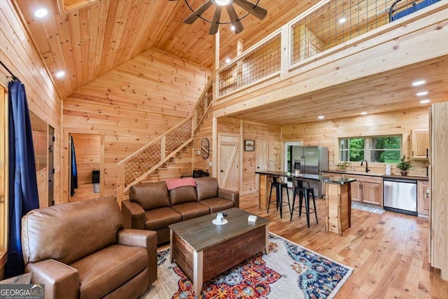2092 Pleasant Hill Rd NE, Ranger, GA 30734 - living room featuring wooden ceiling, wooden walls, high vaulted ceiling, stairs, and ceiling fan