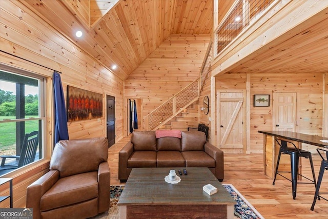 2092 Pleasant Hill Rd NE, Ranger, GA 30734 - living area featuring wood walls, wood ceiling, high vaulted ceiling, stairway, and wood finished floors