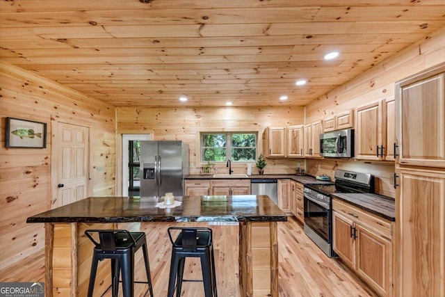2092 Pleasant Hill Rd NE, Ranger, GA 30734 - kitchen with stainless steel appliances, wood ceiling, a kitchen bar, light wood finished floors, and dark countertops