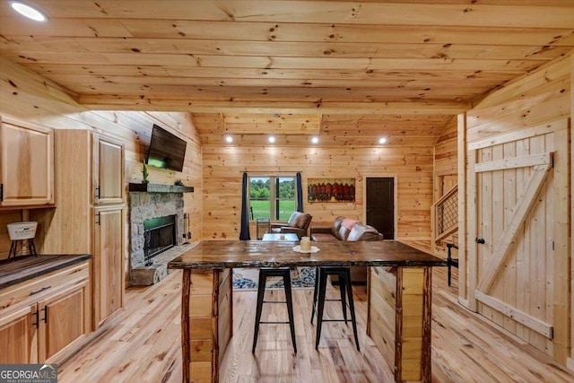 2092 Pleasant Hill Rd NE, Ranger, GA 30734 - dining room featuring wood ceiling, light wood-type flooring, wood walls, and a fireplace