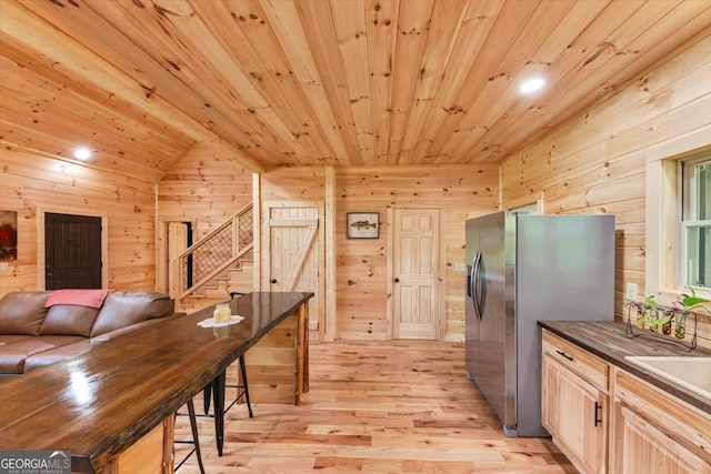 2092 Pleasant Hill Rd NE, Ranger, GA 30734 - kitchen featuring wood walls, light wood-style floors, stainless steel fridge, wooden ceiling, and dark countertops