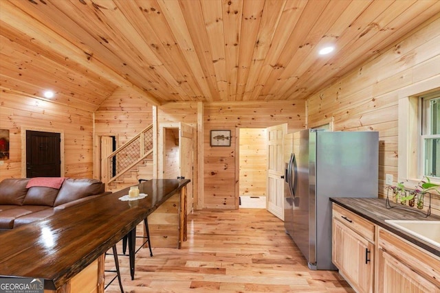 2092 Pleasant Hill Rd NE, Ranger, GA 30734 - kitchen with wood walls, light wood-type flooring, freestanding refrigerator, wooden ceiling, and open floor plan