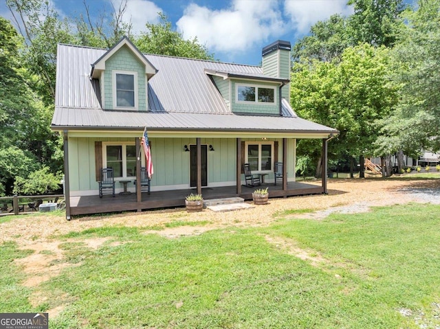 2092 Pleasant Hill Rd NE, Ranger, GA 30734 - view of front of home featuring a chimney, a front lawn, board and batten siding, and covered porch