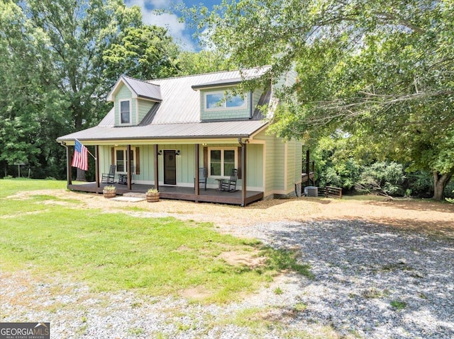 2092 Pleasant Hill Rd NE, Ranger, GA 30734 - view of front of home with board and batten siding, a front yard, a porch, gravel driveway, and view of scattered trees