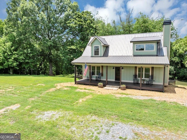 2092 Pleasant Hill Rd NE, Ranger, GA 30734 - view of front facade featuring board and batten siding, a front yard, a chimney, and a metal roof