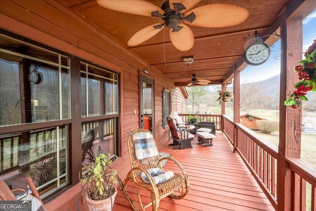 4253 Swallows Creek Rd, Hiawassee, GA 30546 - wooden porch featuring a ceiling fan and a mountain view