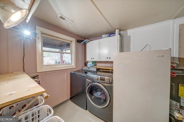 4253 Swallows Creek Rd, Hiawassee, GA 30546 - laundry area with washer and dryer, electric water heater, and cabinet space
