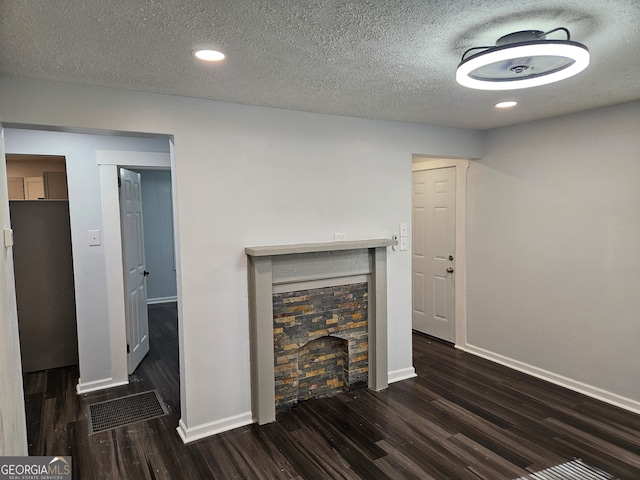 4422 Oates Ave, Columbus, GA 31904 - unfurnished living room featuring a fireplace, wood finished floors, a textured ceiling, and recessed lighting