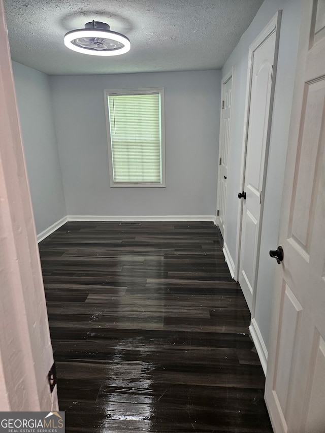 4422 Oates Ave, Columbus, GA 31904 - unfurnished room featuring a textured ceiling and dark wood finished floors