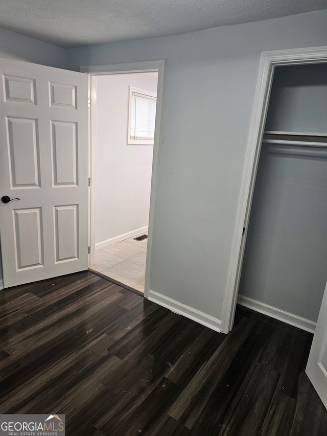 4422 Oates Ave, Columbus, GA 31904 - unfurnished bedroom with wood finished floors and a closet