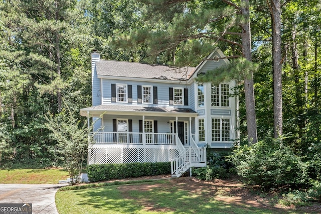 3 Maplelake Dr, Acworth, GA 30101 - colonial house featuring a chimney, covered porch, stairs, and a front yard