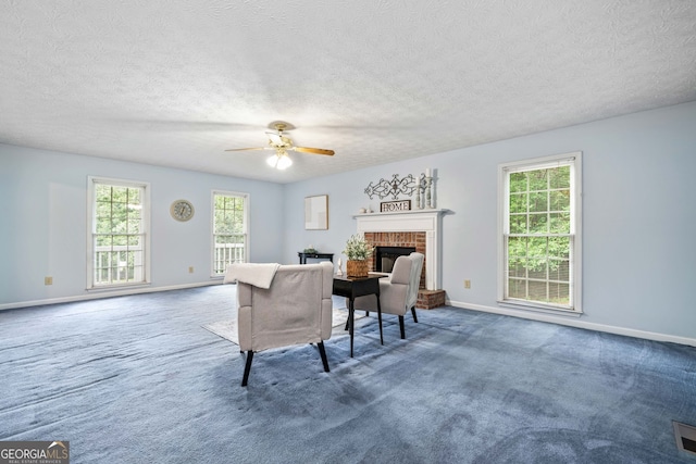 3 Maplelake Dr, Acworth, GA 30101 - living area with a brick fireplace, a ceiling fan, carpet floors, and a textured ceiling