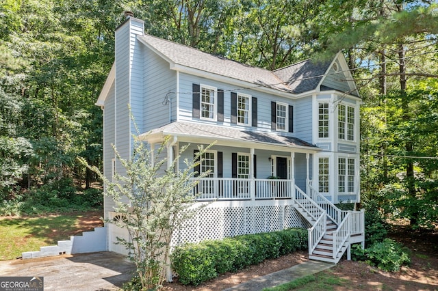 3 Maplelake Dr, Acworth, GA 30101 - view of front of property featuring covered porch, a chimney, stairway, a shingled roof, and an attached garage