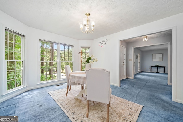 3 Maplelake Dr, Acworth, GA 30101 - carpeted dining space with a chandelier and a textured ceiling