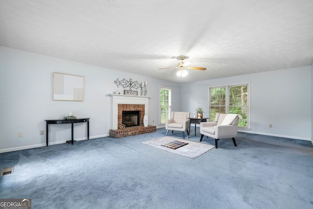 3 Maplelake Dr, Acworth, GA 30101 - carpeted living area with a ceiling fan, a brick fireplace, and a textured ceiling