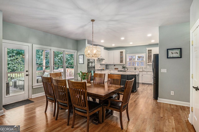 351 Prestbury Ct, Suwanee, GA 30024 - dining area with a chandelier, wood finished floors, and recessed lighting