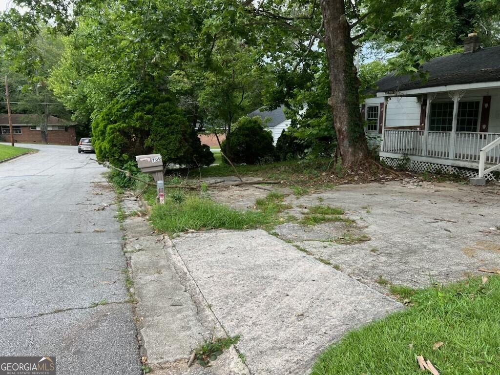 766 Warren Dr, Riverdale, GA 30296 - view of yard featuring covered porch