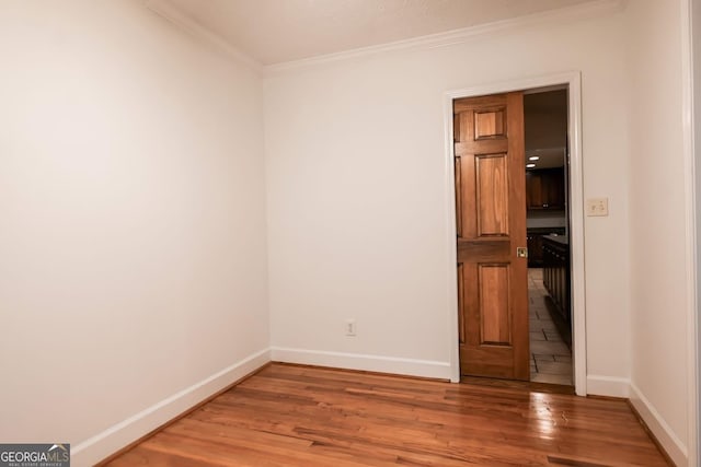 500 Holmes St, Barnesville, GA 30204 - unfurnished room with wood finished floors and ornamental molding