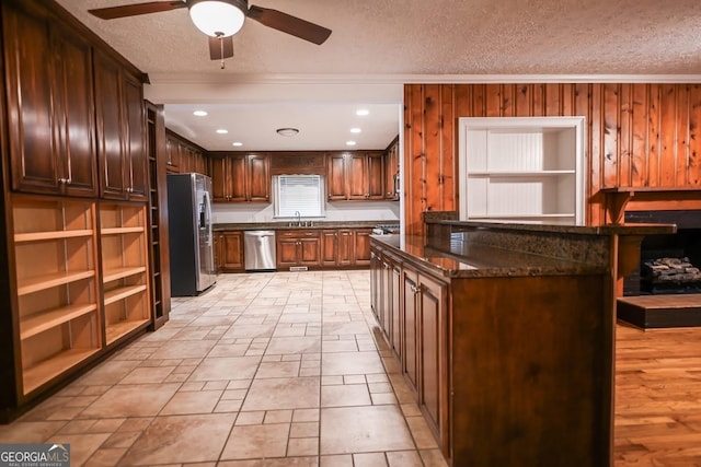 500 Holmes St, Barnesville, GA 30204 - kitchen with appliances with stainless steel finishes, ornamental molding, ceiling fan, a textured ceiling, and open shelves