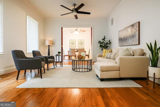 500 Holmes St, Barnesville, GA 30204 - living room featuring a ceiling fan, ornamental molding, and wood finished floors