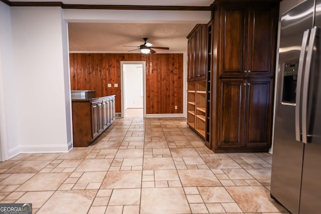500 Holmes St, Barnesville, GA 30204 - kitchen with stainless steel fridge, ceiling fan, wooden walls, crown molding, and dark brown cabinets