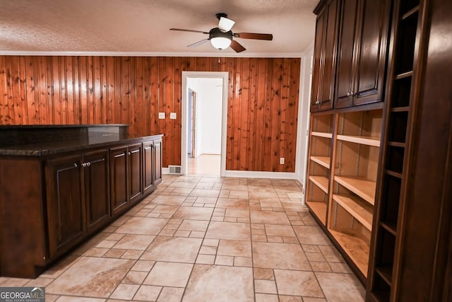 500 Holmes St, Barnesville, GA 30204 - bar featuring a ceiling fan, wood walls, crown molding, and a textured ceiling