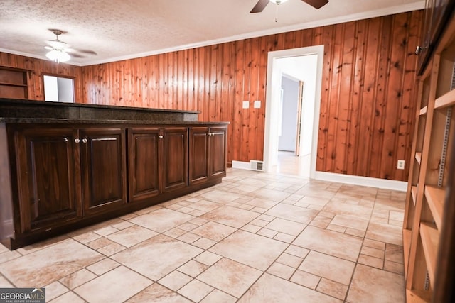 500 Holmes St, Barnesville, GA 30204 - bar with a ceiling fan, crown molding, wooden walls, and a textured ceiling