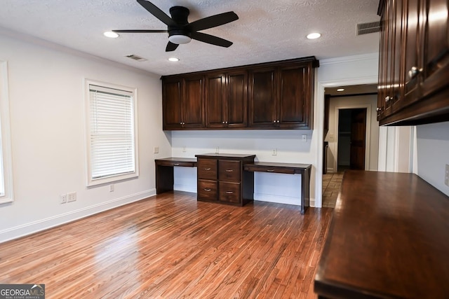 500 Holmes St, Barnesville, GA 30204 - kitchen with dark brown cabinets, a ceiling fan, light wood finished floors, a textured ceiling, and recessed lighting
