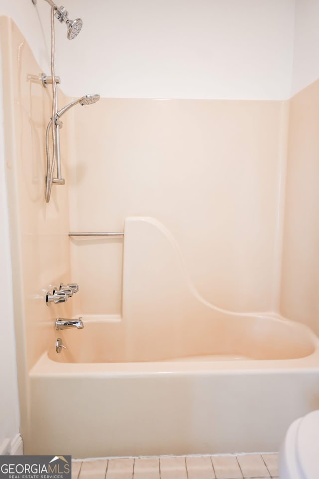 500 Holmes St, Barnesville, GA 30204 - full bath featuring tile patterned flooring and  shower combination