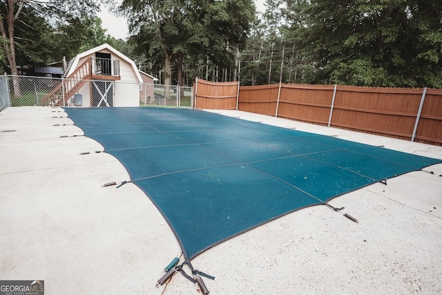 500 Holmes St, Barnesville, GA 30204 - view of swimming pool with stairs and view of wooded area